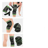 Knee compression sleeves on legs; black knit with neon green bands and straps
