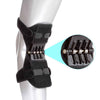 Black knee support pad with cushioned wrap and spring-loaded center plate