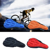 Bike seat cushion covers in blue, orange, and black on a rugged surface