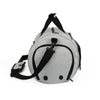 Light gray duffel bag with front zipper pocket, curved end panels, and black shoulder strap.