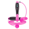Cordless digital jump rope, glossy pink handles and black display unit with loop cable