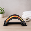 Back pain relief massage stretcher with arched frame and raised nodes