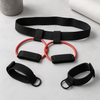 Booty resistance band set laid flat: black belt, red elastic loop, and ankle cuffs