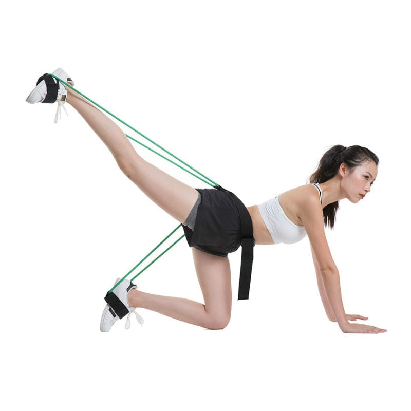 Resistance band set with green elastic bands and black ankle harness for stretching