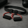 Booty resistance band set components: black belt and red elastic loop with ankle straps
