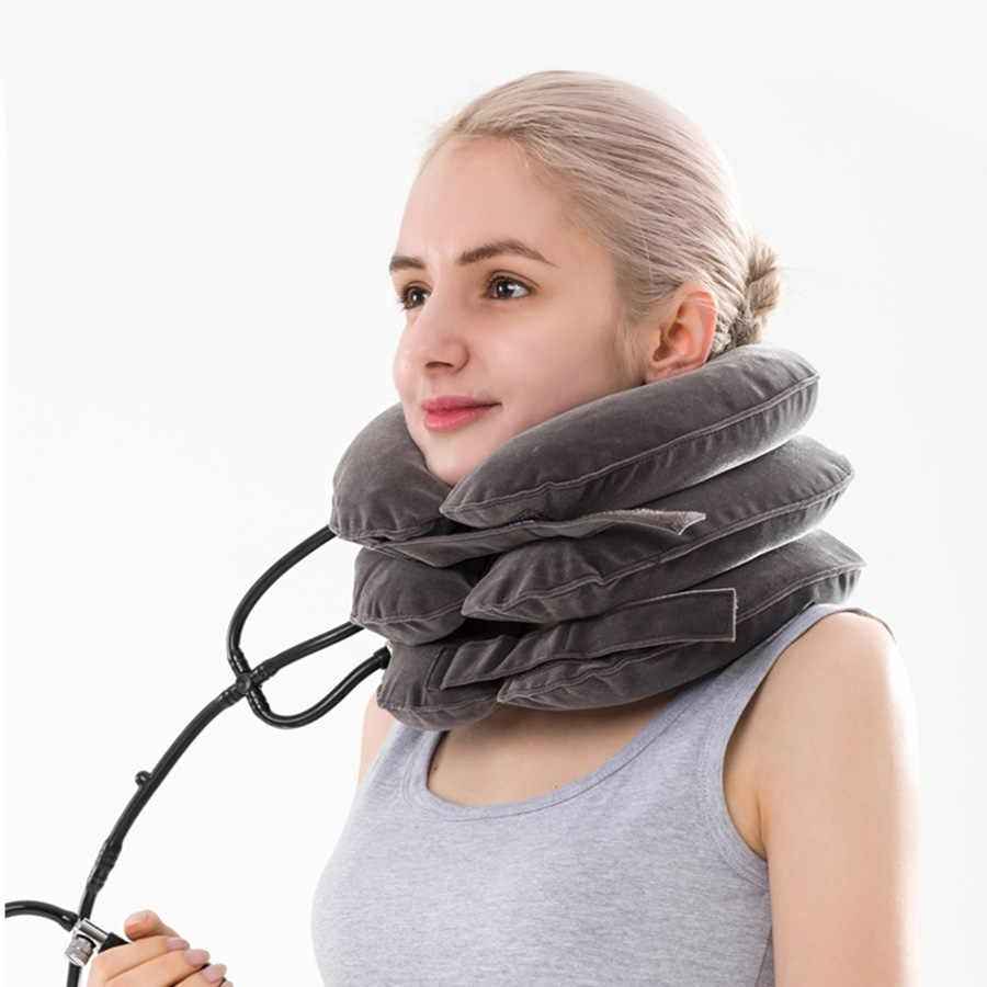 Neck traction pillow worn around neck, gray fabric with attached air hose