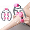 U-shape massage roller with pink spiked wheels on dark gray handle, pressed on forearm