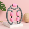 U-shaped 360° massage roller with pink textured wheels on dark gray handles