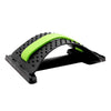 Massage stretcher with green padded arch, black frame, and raised nubs