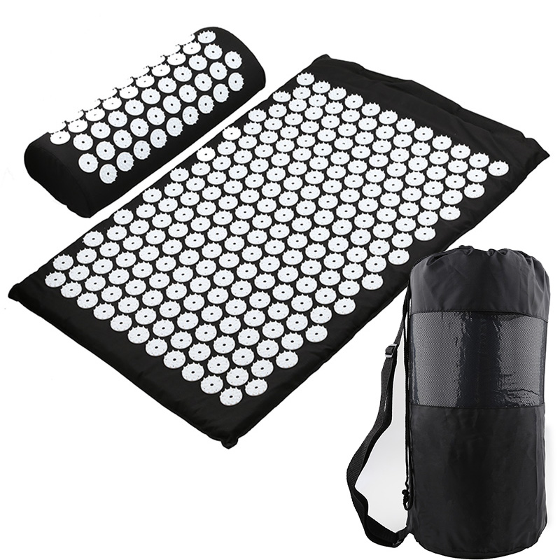 Black acupressure yoga mat set with matching cushion and carrying bag
