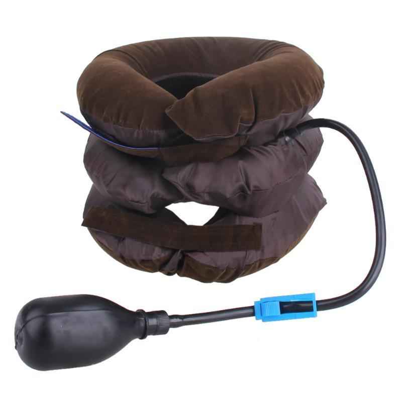 Neck traction pillow with attached hose and blue connector, dark brown fabric