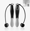 Cordless digital jump rope handles set with black bodies, gray grips, and black rope ends