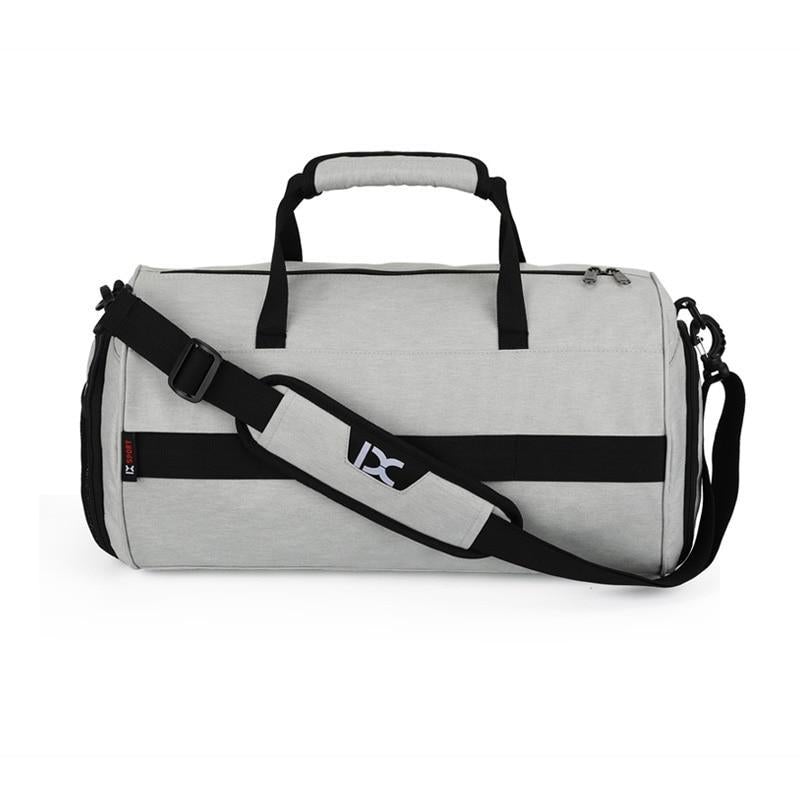 Light gray gym duffel bag with black shoulder strap and top handle, X sport logo.