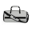 Light gray gym duffel bag with black shoulder strap and top handle, X sport logo.
