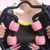 Arm massage roller with pink spiked wheels on black frame, held with two hands